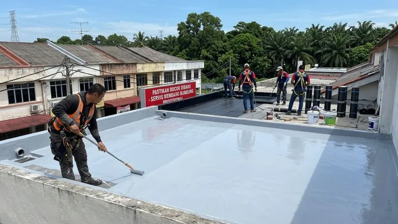 Completed waterproofed concrete flat roof on a Malaysian shophouse showing clean sealed surface with proper drainage slopes